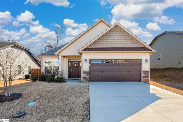 craftsman house featuring central AC and a garage