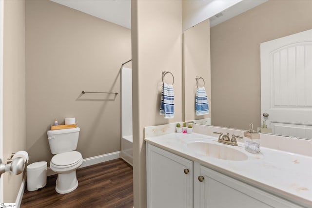 bathroom featuring hardwood / wood-style floors, toilet, and vanity