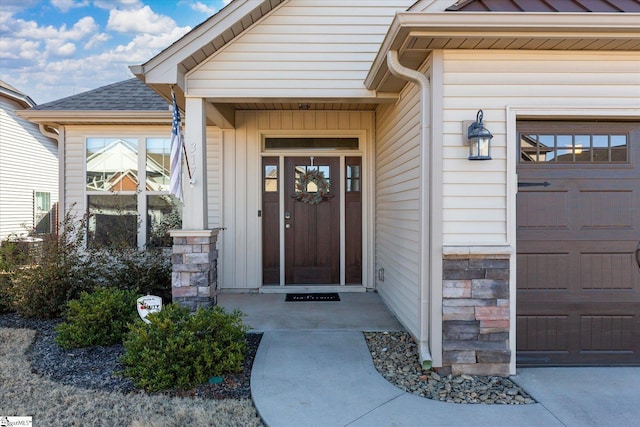 doorway to property featuring a garage