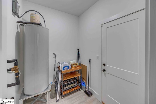 interior space with gas water heater and light wood-type flooring