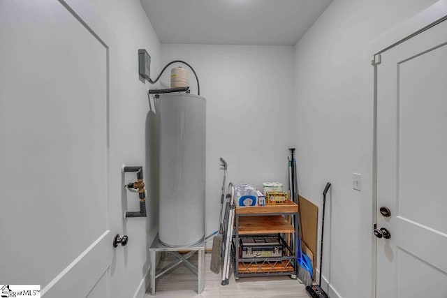 utility room with gas water heater