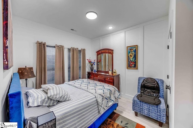 bedroom featuring light wood-type flooring