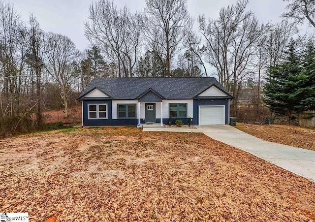 single story home featuring a garage