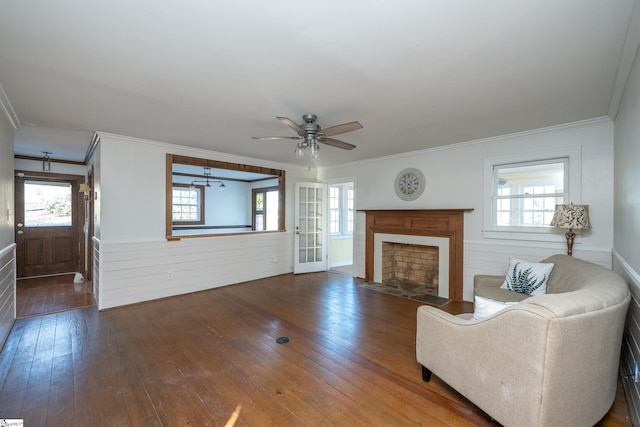 unfurnished living room with ornamental molding, hardwood / wood-style floors, ceiling fan, and french doors