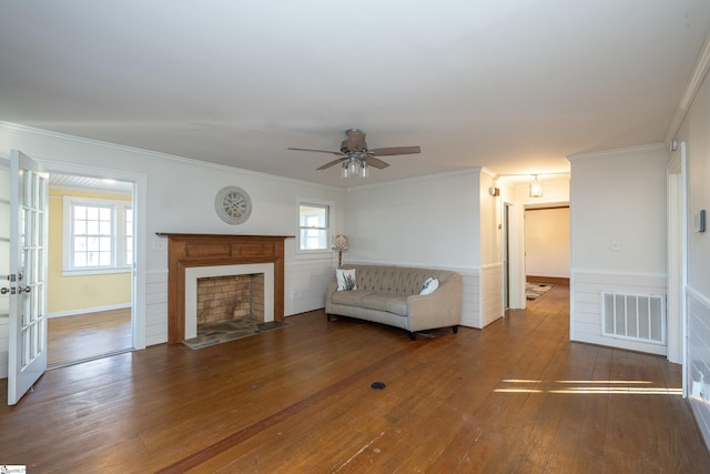 unfurnished living room featuring crown molding, ceiling fan, and hardwood / wood-style flooring