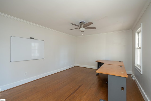 unfurnished office with crown molding, ceiling fan, and dark hardwood / wood-style flooring