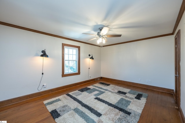 empty room with crown molding, dark hardwood / wood-style floors, and ceiling fan