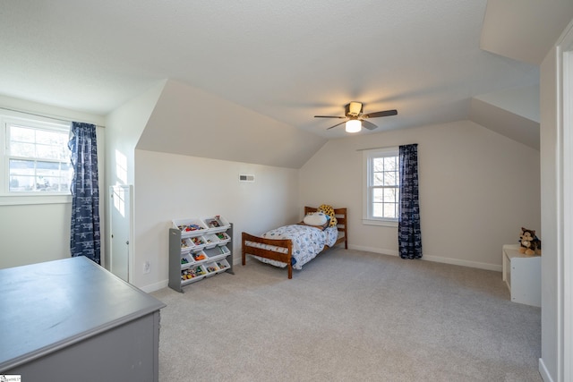 carpeted bedroom featuring vaulted ceiling and ceiling fan