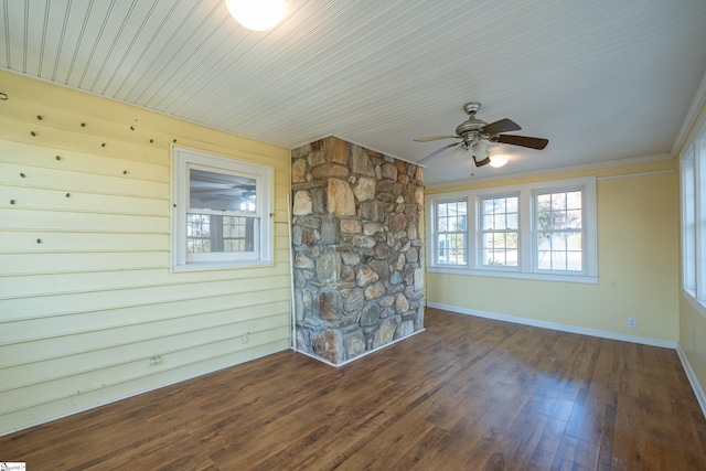 interior space with ornamental molding, ceiling fan, and dark hardwood / wood-style flooring