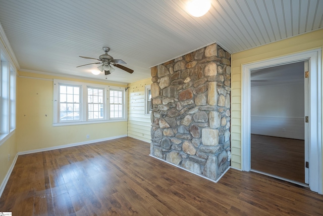 unfurnished living room featuring dark wood-type flooring and ceiling fan