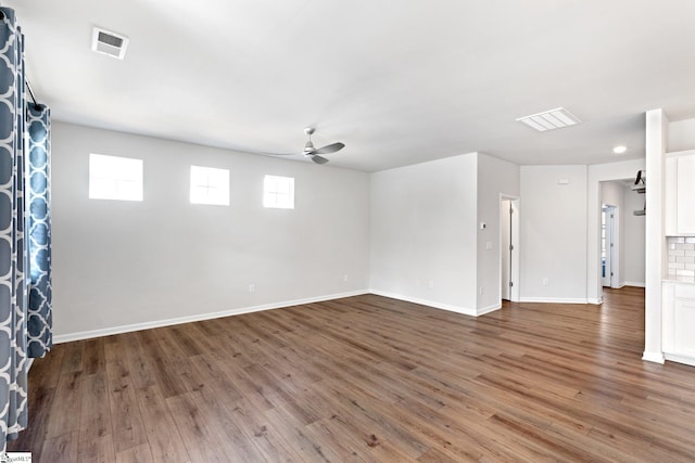 unfurnished room with ceiling fan and hardwood / wood-style floors