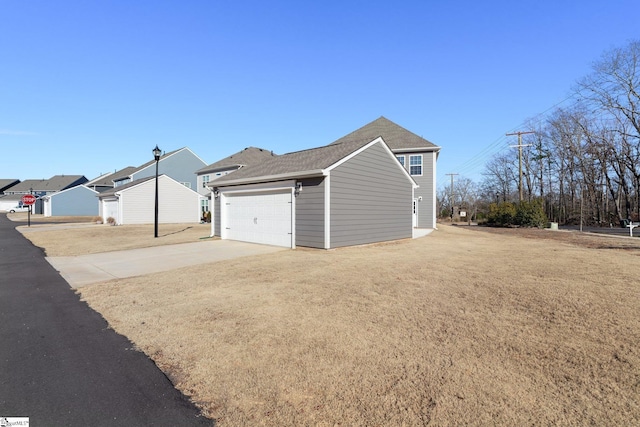 garage with a lawn