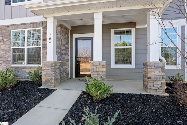 doorway to property featuring covered porch