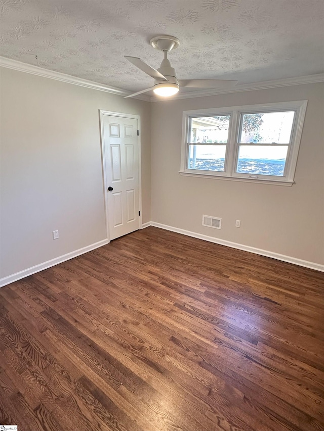 unfurnished room featuring ceiling fan, ornamental molding, dark hardwood / wood-style floors, and a textured ceiling