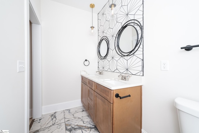 bathroom with toilet and vanity