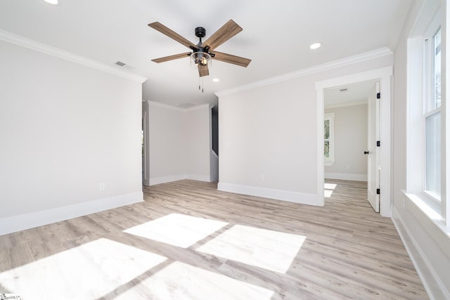 empty room featuring ceiling fan, light hardwood / wood-style flooring, and ornamental molding