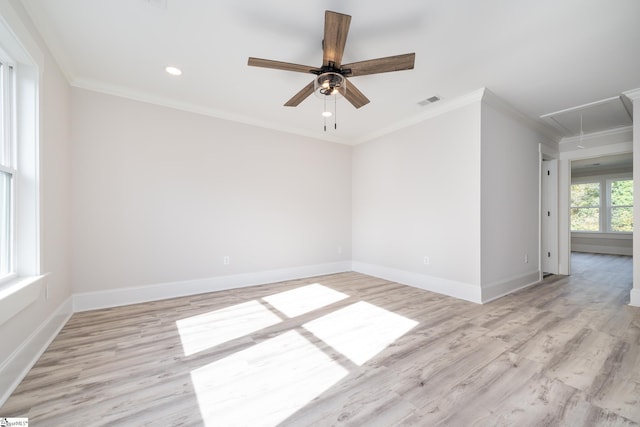 empty room featuring ceiling fan, light hardwood / wood-style flooring, and ornamental molding