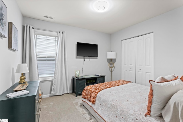 carpeted bedroom with a closet