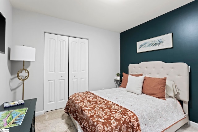 carpeted bedroom featuring a closet