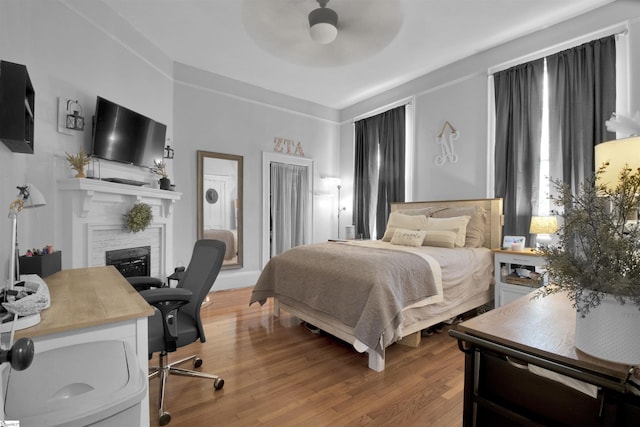 bedroom featuring ceiling fan and light hardwood / wood-style floors