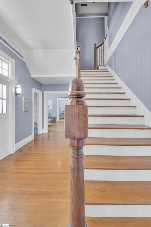 stairway featuring hardwood / wood-style floors