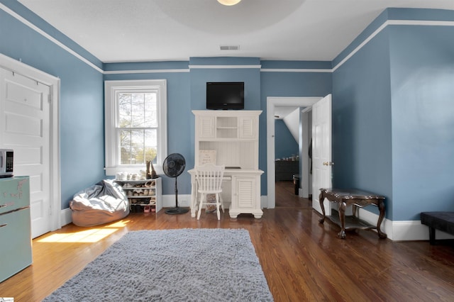 sitting room featuring dark hardwood / wood-style flooring