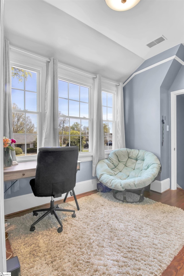 office featuring vaulted ceiling and hardwood / wood-style flooring