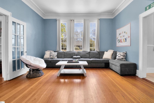 living room featuring ornamental molding and hardwood / wood-style floors