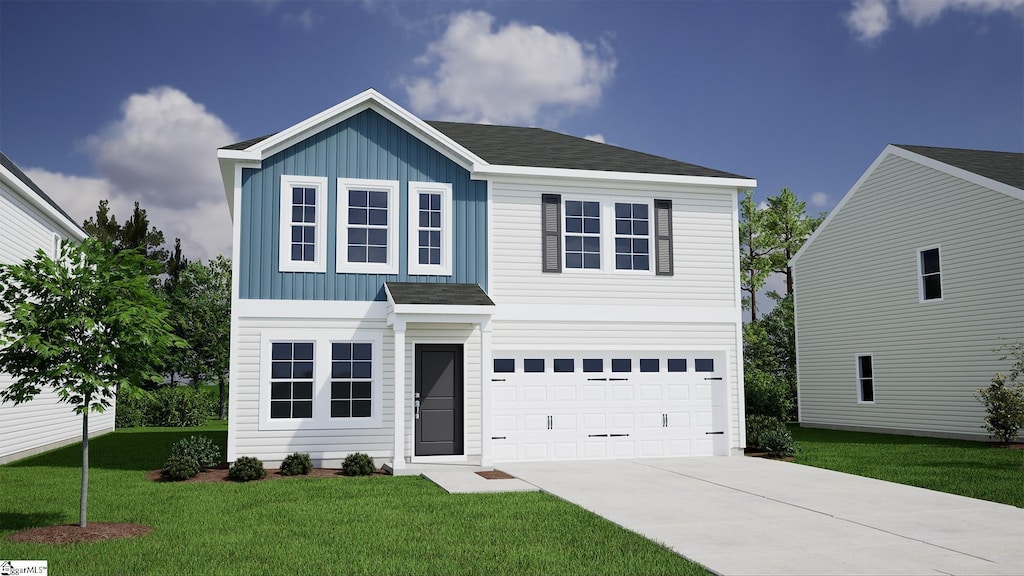 view of front of property with a garage and a front yard