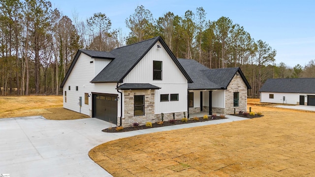 modern farmhouse style home with a garage and covered porch