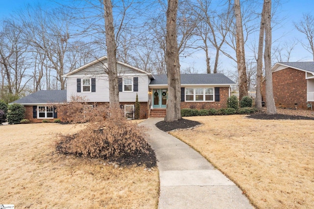 split level home with a front yard