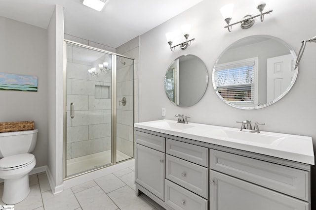 bathroom featuring vanity, toilet, tile patterned floors, and a shower with door