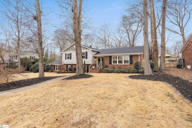 split level home with a front yard