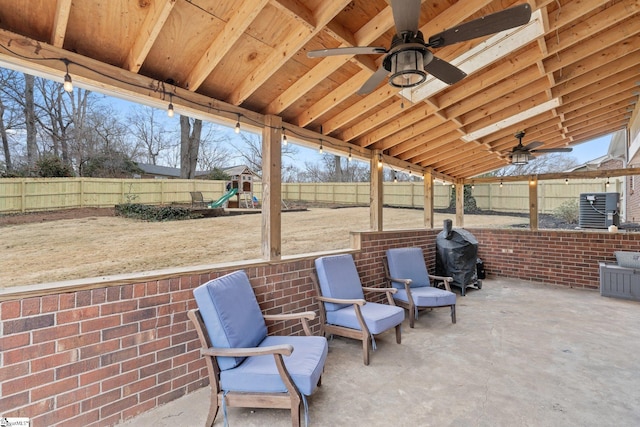 view of patio / terrace featuring ceiling fan, cooling unit, a playground, and a grill