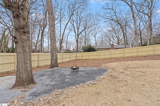 view of yard featuring a fire pit