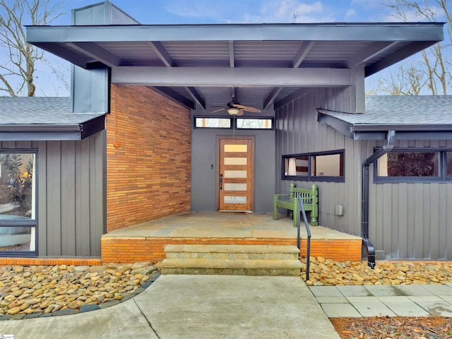 property entrance with ceiling fan and a patio area