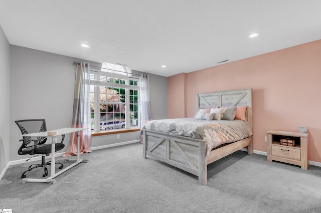 bedroom featuring light carpet