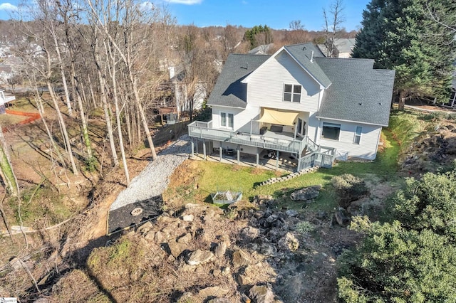 back of house featuring a deck