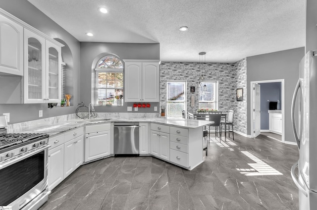 kitchen featuring sink, white cabinetry, and stainless steel appliances