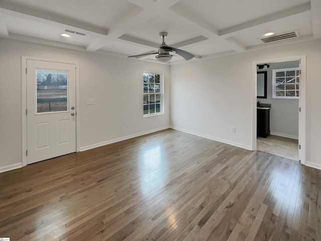 entryway featuring ceiling fan, hardwood / wood-style floors, beamed ceiling, and coffered ceiling