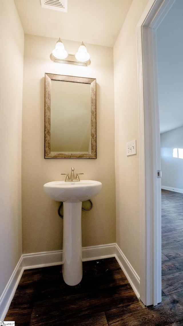 bathroom featuring wood-type flooring