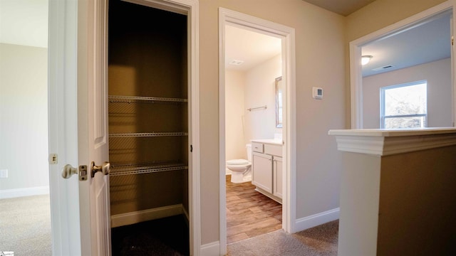 bathroom featuring toilet and vanity