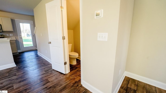 corridor featuring dark wood-type flooring