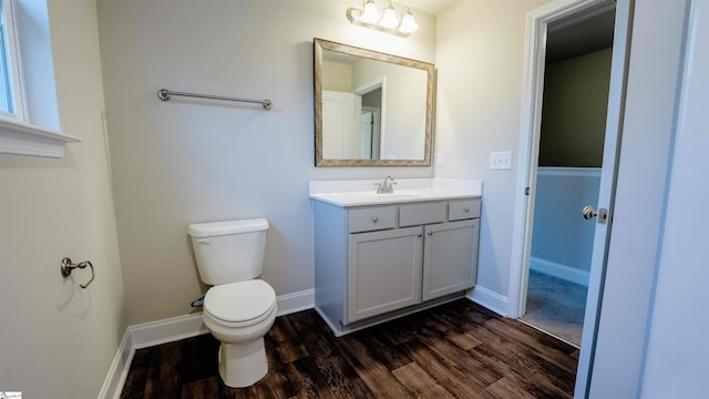 bathroom with vanity, hardwood / wood-style flooring, and toilet