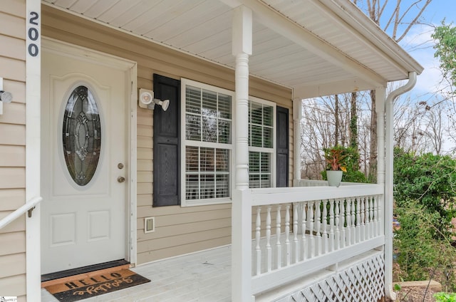 property entrance featuring a porch