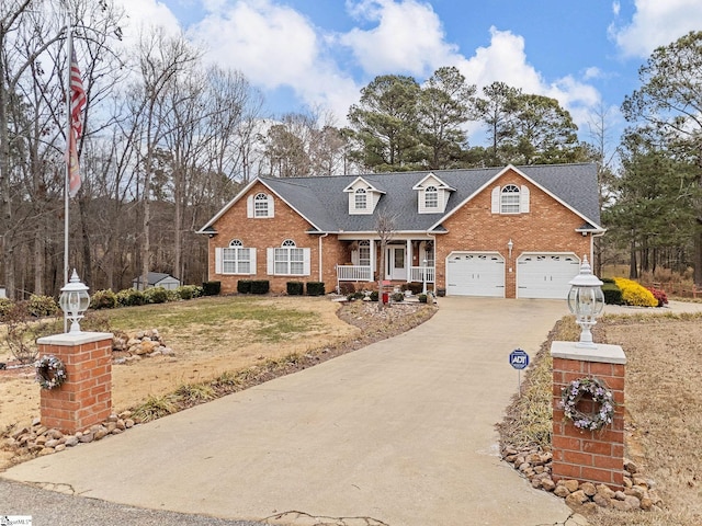 view of front of home featuring covered porch and a garage