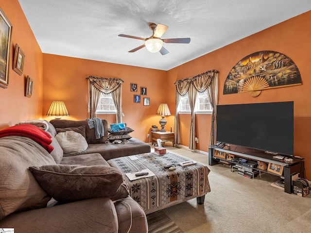 carpeted living room with a healthy amount of sunlight, a textured ceiling, and ceiling fan