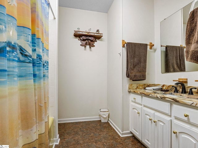 bathroom with shower / tub combo with curtain and vanity