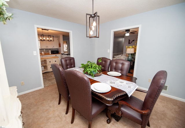 view of carpeted dining space