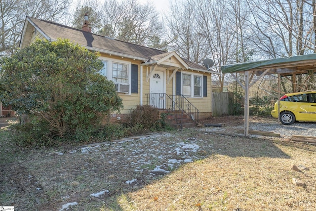 bungalow-style home featuring cooling unit